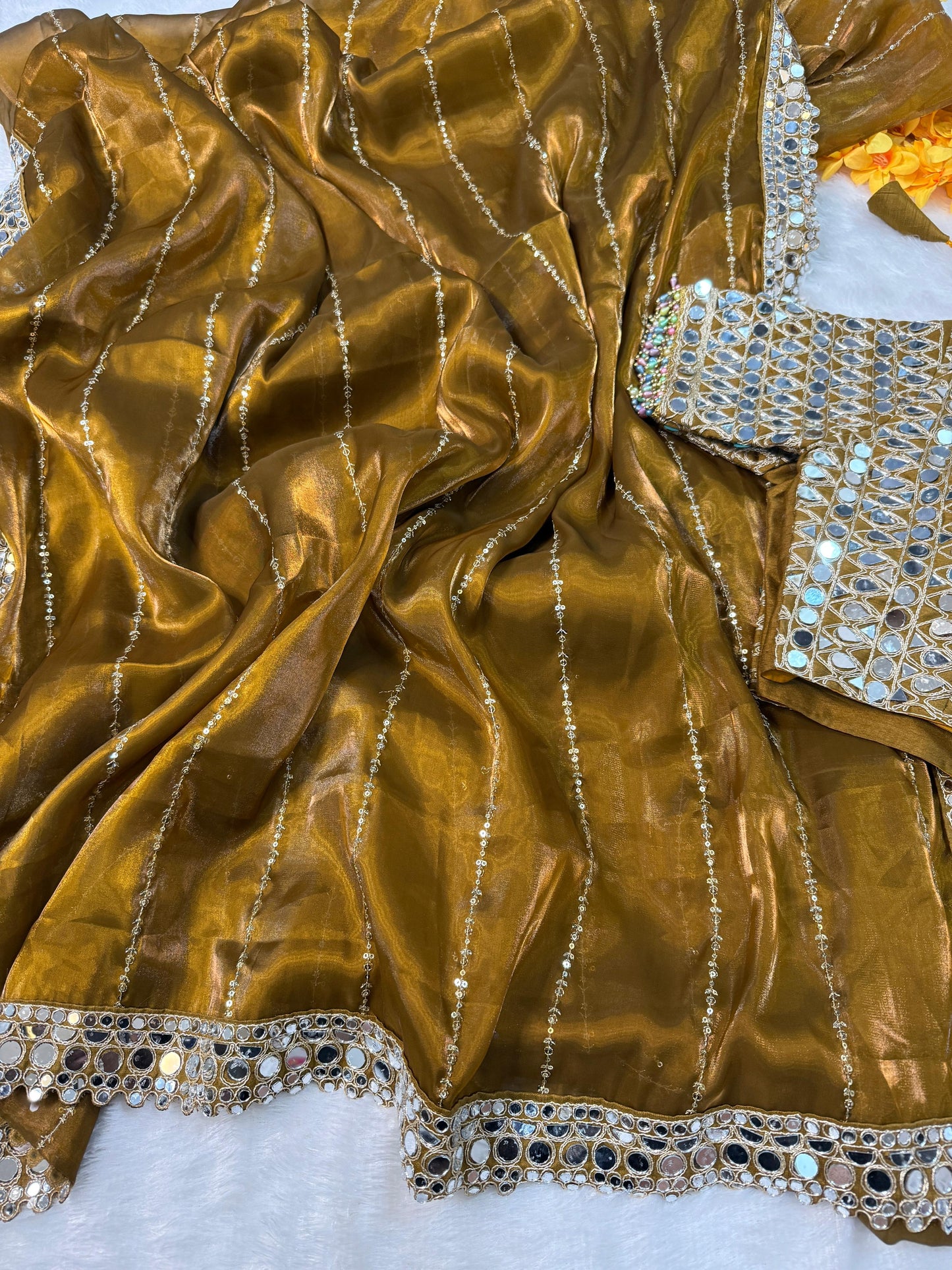 Soft satin Organza saree which is embedded with real mirror work