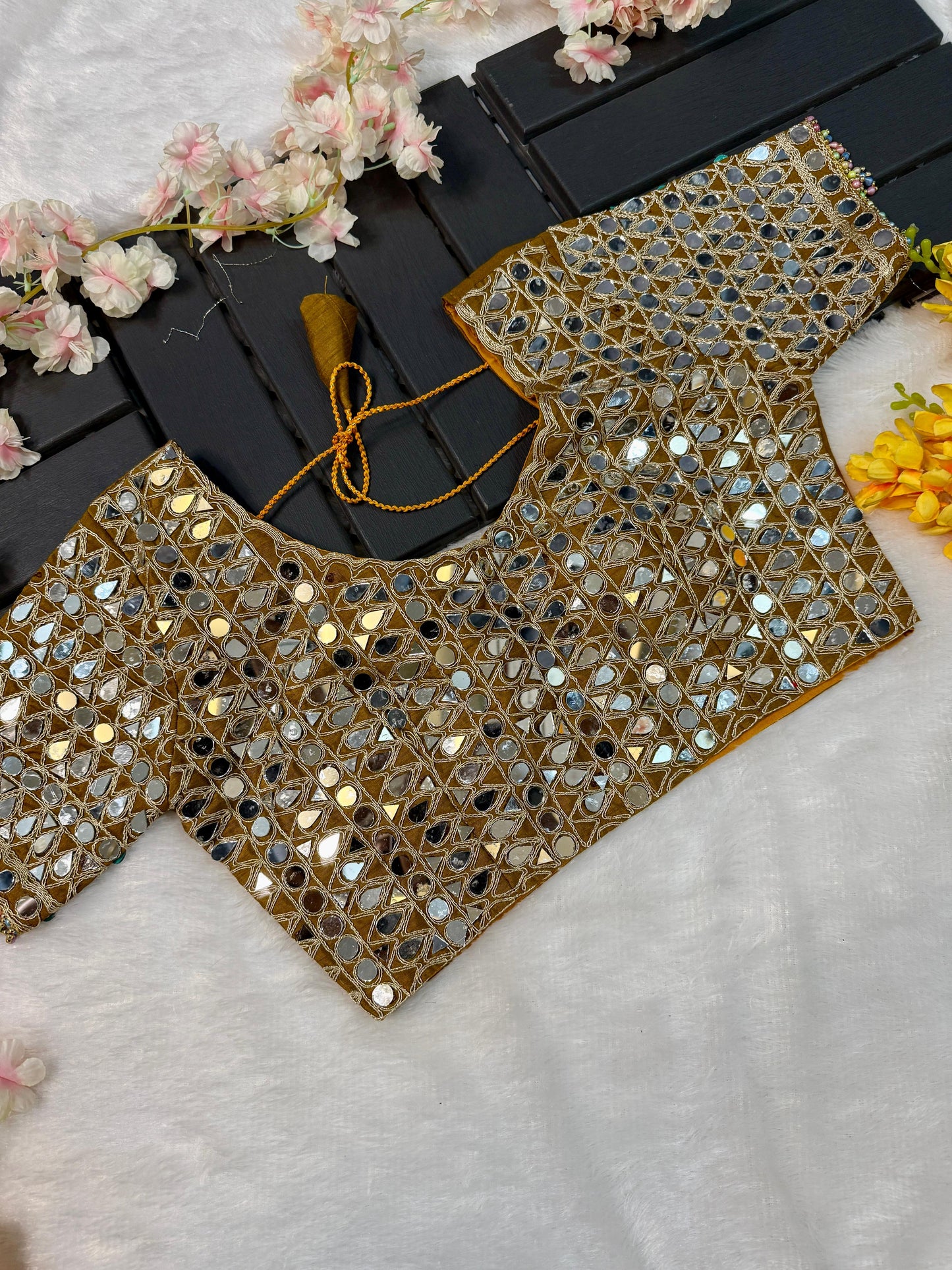 Soft satin Organza saree which is embedded with real mirror work