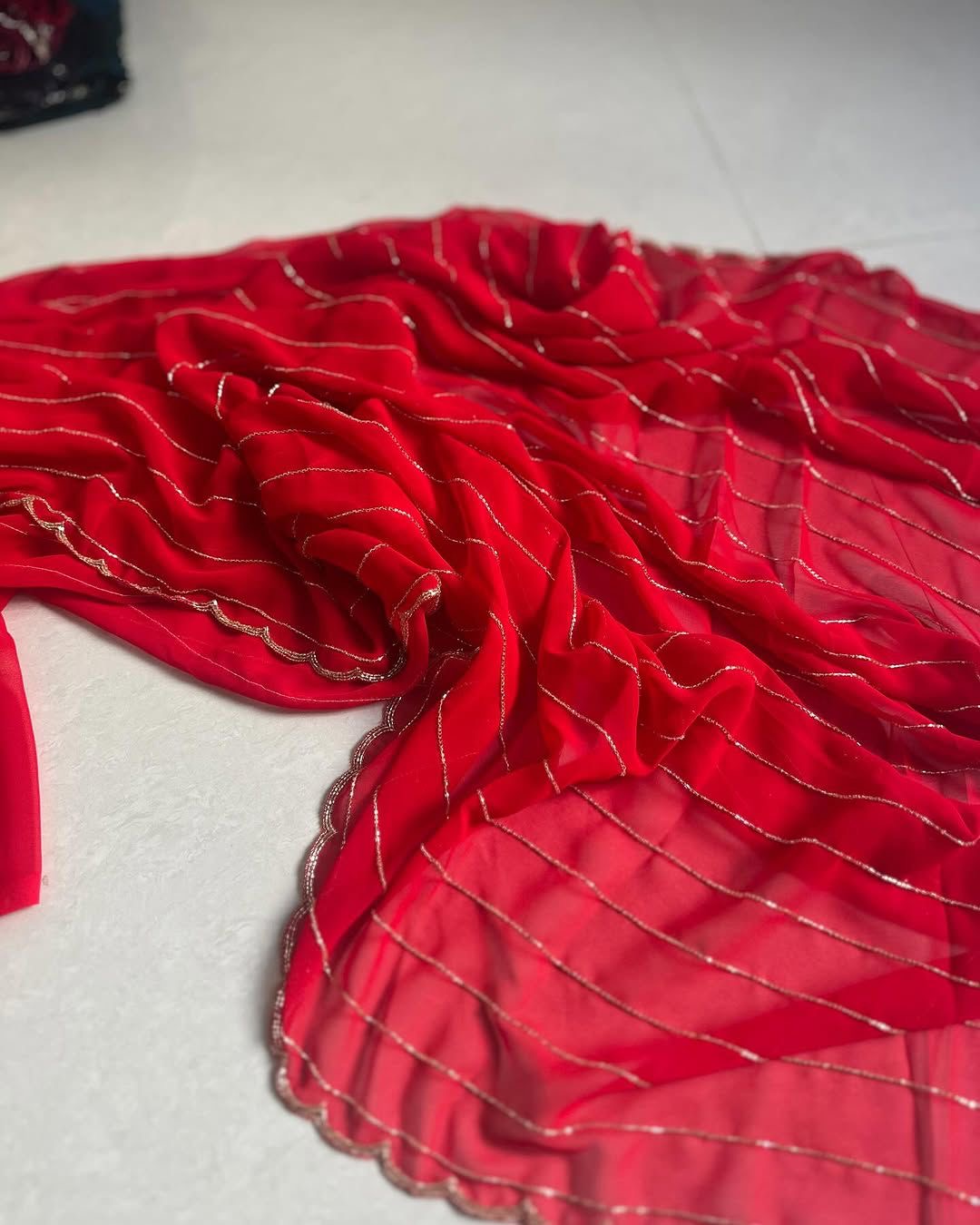 pure red georgette saree with handwork
