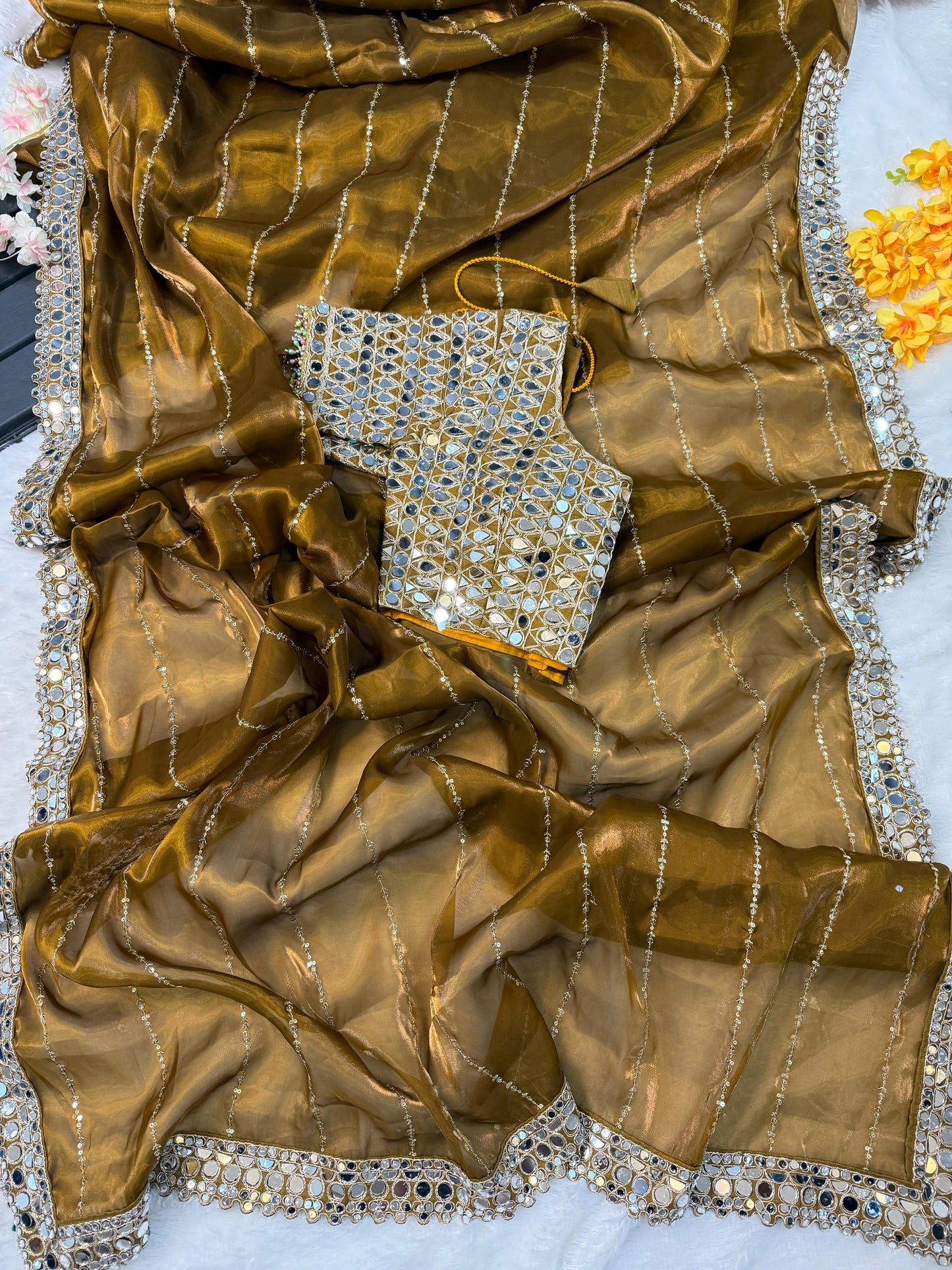 Soft satin Organza saree which is embedded with real mirror work
