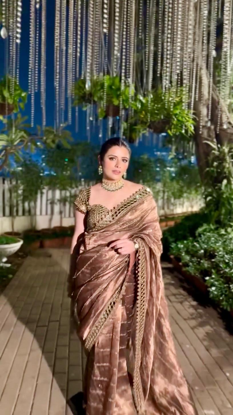 Soft satin Organza saree which is embedded with real mirror work
