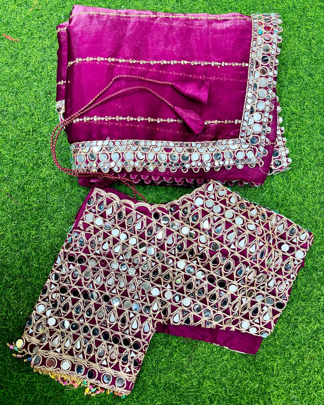 Soft satin Organza saree which is embedded with real mirror work