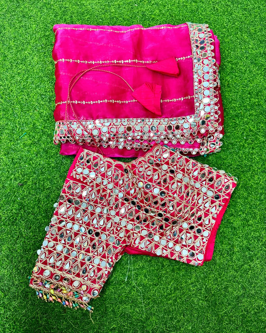 Soft satin Organza saree which is embedded with real mirror work