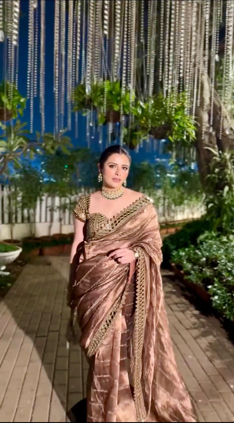 Soft satin Organza saree which is embedded with real mirror work