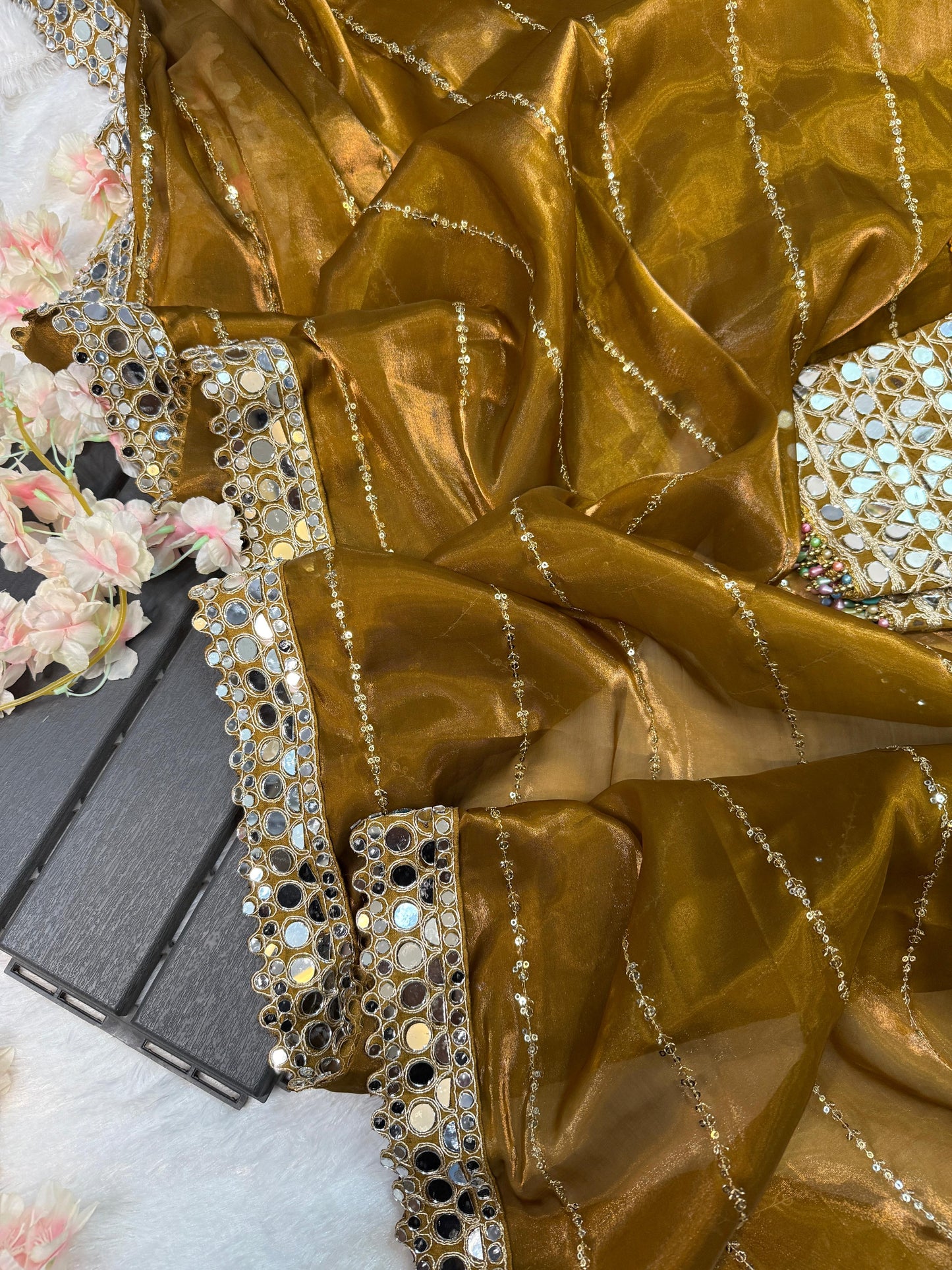 Soft satin Organza saree which is embedded with real mirror work