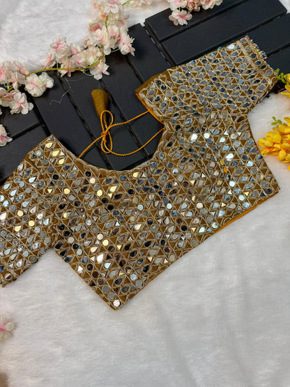 Soft satin Organza saree which is embedded with real mirror work