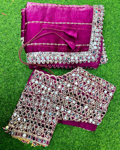 Soft satin Organza saree which is embedded with real mirror work