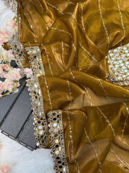 Soft satin Organza saree which is embedded with real mirror work