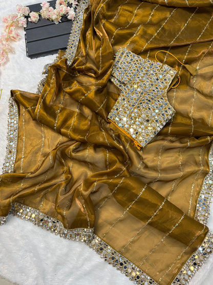 Soft satin Organza saree which is embedded with real mirror work